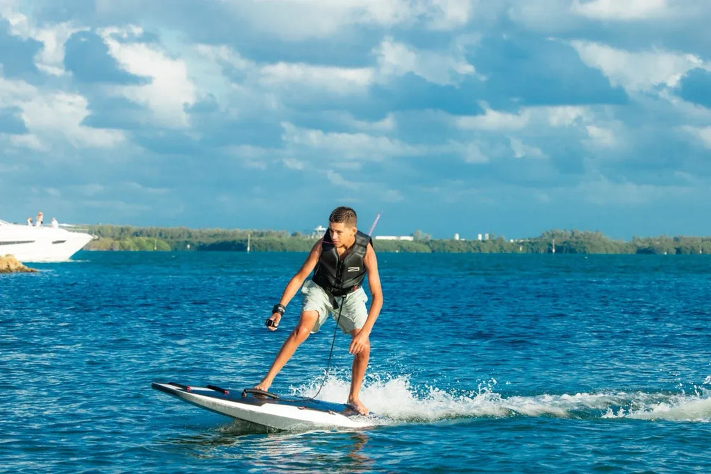 Awake RÄVIK Explore beginner electric surfboard on a lake